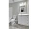 This bathroom has a tub, toilet, and vanity at 11803 W Tufts Pl, Morrison, CO 80465