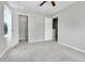 This bedroom has neutral walls, carpet, and natural light at 11803 W Tufts Pl, Morrison, CO 80465