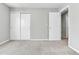 This bedroom has neutral walls, carpet, and closet at 11803 W Tufts Pl, Morrison, CO 80465