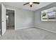 This bedroom has neutral walls, carpet, and natural light at 11803 W Tufts Pl, Morrison, CO 80465
