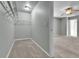 Walk-in closet featuring carpet flooring, wire shelving, and neutral paint, for functional and tidy storage at 11803 W Tufts Pl, Morrison, CO 80465