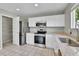 Well-appointed kitchen with stainless steel appliances, granite countertops, and ample cabinet space at 11803 W Tufts Pl, Morrison, CO 80465