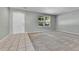 Bright living room featuring neutral paint, tile entry, plush carpet and abundant natural light from the large windows at 11803 W Tufts Pl, Morrison, CO 80465
