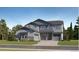 New construction home with two-car garage and stone accents on a well maintained lawn at 661 Sunrise St, Erie, CO 80516