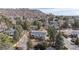 Aerial view of the home shows the large lot with mature trees at 391 Burgess Dr, Castle Rock, CO 80104