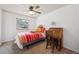 Bedroom with a teddy bear, bed, desk, and chair at 391 Burgess Dr, Castle Rock, CO 80104