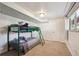 A bedroom with bunk beds and neutral carpet at 391 Burgess Dr, Castle Rock, CO 80104