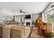 Inviting living room features a fireplace, a large sectional sofa, and a vintage piano at 391 Burgess Dr, Castle Rock, CO 80104