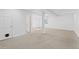 Large finished basement space with carpet and access to other rooms at 10157 W Fremont Pl, Littleton, CO 80127