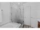 Beautiful bathroom with a glass shower, shower seat, and marble tile work at 10157 W Fremont Pl, Littleton, CO 80127