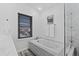 Elegant bathroom showcases a soaking tub and glass-enclosed shower at 10157 W Fremont Pl, Littleton, CO 80127