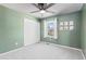 Bedroom featuring a ceiling fan, closet, and light green walls at 10157 W Fremont Pl, Littleton, CO 80127