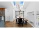 Bright dining room with skylights and modern lighting and wooden floors at 10157 W Fremont Pl, Littleton, CO 80127