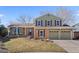Inviting two-story home with brick accents, dual garage, and well-maintained landscaping at 10157 W Fremont Pl, Littleton, CO 80127