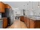 Bright kitchen with skylights, wood cabinets, granite counters and stainless steel appliances at 10157 W Fremont Pl, Littleton, CO 80127