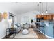 Cozy living space featuring hardwood floors, a breakfast bar, and modern decor at 10157 W Fremont Pl, Littleton, CO 80127