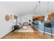Open living area with hardwood floors, modern lighting, and stylish furniture at 10157 W Fremont Pl, Littleton, CO 80127