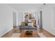 Cozy living room with hardwood floors and a view of the dining area at 10157 W Fremont Pl, Littleton, CO 80127