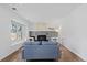 Bright living room features a fireplace, modern decor, and hardwood floors at 10157 W Fremont Pl, Littleton, CO 80127