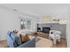 Cozy living room features a fireplace, hardwood floors and a large window at 10157 W Fremont Pl, Littleton, CO 80127