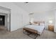 Well-lit bedroom with two windows and bench seating at 10157 W Fremont Pl, Littleton, CO 80127