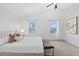 Bright bedroom featuring a vaulted ceiling, soft carpet and bench seating at 10157 W Fremont Pl, Littleton, CO 80127