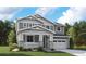 Charming two-story home with a welcoming front porch, a two-car garage, and classic architectural details at 2633 Sawyer Ln, Erie, CO 80026