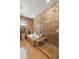 Beautiful bathroom featuring a soaking tub, a glass-enclosed shower, and tiled walls at 5455 Landmark Pl # 1106, Greenwood Village, CO 80111