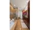 Elegant bathroom with a soaking tub, glass-enclosed shower, and modern vanity at 5455 Landmark Pl # 1106, Greenwood Village, CO 80111