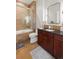 Well-lit bathroom featuring a tiled shower, vanity with sink, and modern fixtures at 5455 Landmark Pl # 1106, Greenwood Village, CO 80111