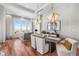 Stylish dining area with modern lighting, comfortable seating, and stunning city views at 5455 Landmark Pl # 1106, Greenwood Village, CO 80111