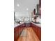 Gourmet kitchen features modern appliances, wine fridge, and views in an open-concept space at 5455 Landmark Pl # 1106, Greenwood Village, CO 80111