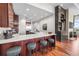 Kitchen features island with bar seating and modern appliances at 5455 Landmark Pl # 1106, Greenwood Village, CO 80111
