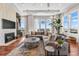 Cozy living room featuring a fireplace, large windows, and comfortable seating area at 5455 Landmark Pl # 1106, Greenwood Village, CO 80111