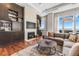 Elegant living room with custom built-ins, a fireplace, and plush seating at 5455 Landmark Pl # 1106, Greenwood Village, CO 80111