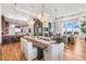 Open-concept living room with dining area, fireplace, and stunning views from the large windows at 5455 Landmark Pl # 1106, Greenwood Village, CO 80111