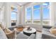 Bright living room with balcony access and large windows offering panoramic views at 5455 Landmark Pl # 1106, Greenwood Village, CO 80111