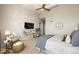 Cozy main bedroom offering a comfortable seating area and soft lighting, with plush carpeting at 5455 Landmark Pl # 1106, Greenwood Village, CO 80111