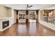 Bright living room featuring a fireplace, hardwood floors, and sliding glass doors leading to the backyard at 2357 Morningview Ln, Castle Rock, CO 80109