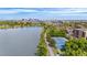 View from park shows a scenic lake, tennis courts, and the city skyline in the background at 5125 W 29Th Ave # 5, Denver, CO 80212