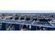 An amazing rooftop patio with an aerial view of a lake and mountain range off in the distance at 5125 W 29Th Ave # 5, Denver, CO 80212