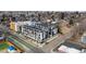 Real estate showcasing modern urban living with rooftop decks, set in a vibrant neighborhood and green-lined streets at 5125 W 29Th Ave # 5, Denver, CO 80212