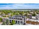Aerial view of community rooftop deck featuring city views, landscaping, and resident seating at 5125 W 29Th Ave # 5, Denver, CO 80212