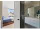 Modern bathroom showcasing a sleek glass shower adjacent to the tranquil bedroom at 5125 W 29Th Ave # 5, Denver, CO 80212