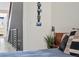 Stylish bedroom design with decorative accents and an open staircase view at 5125 W 29Th Ave # 5, Denver, CO 80212