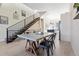 Modern dining area with contemporary table and chairs adjacent to a staircase and stylish kitchen at 5125 W 29Th Ave # 5, Denver, CO 80212