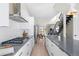 Modern kitchen with gray island, stainless steel appliances, and open layout at 5125 W 29Th Ave # 5, Denver, CO 80212