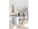 Bright kitchen features a large island with bar seating, sleek appliances, and an open design at 5125 W 29Th Ave # 5, Denver, CO 80212