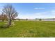 Scenic park view featuring lush green grass, mature trees, and a serene lake in the background, perfect for recreation at 5125 W 29Th Ave # 5, Denver, CO 80212
