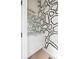 Stylish powder room with unique wallpaper, modern vanity, and elegant lighting fixture at 5125 W 29Th Ave # 5, Denver, CO 80212